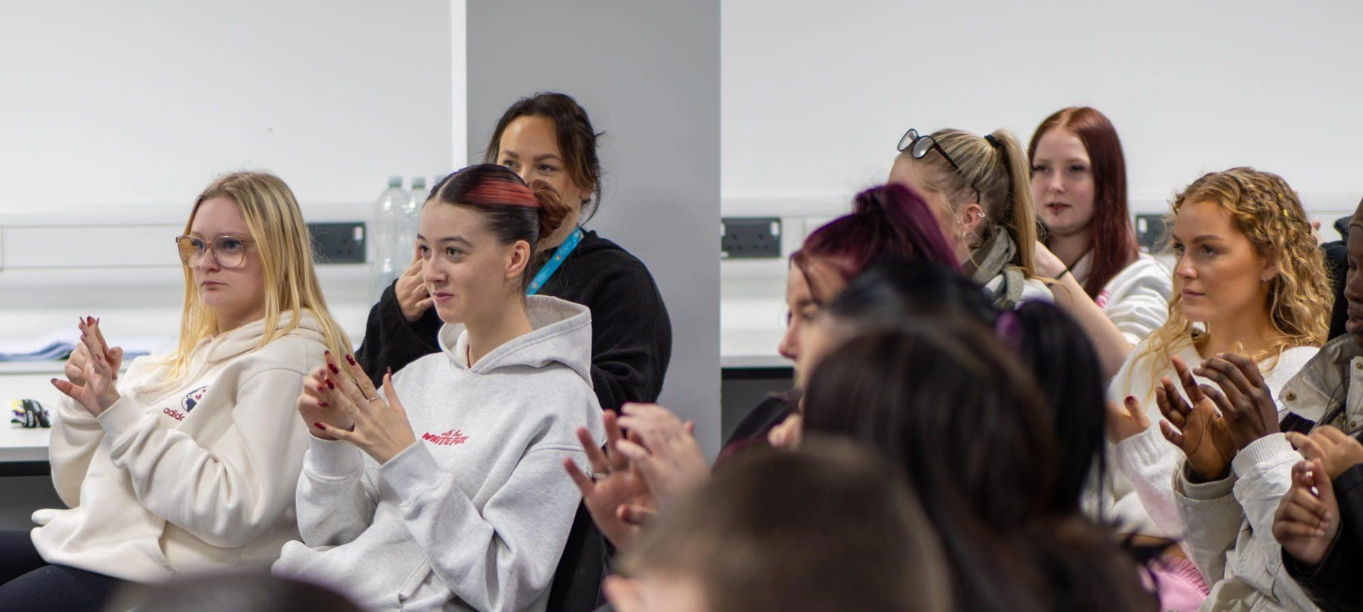 Group of students clapping jpg