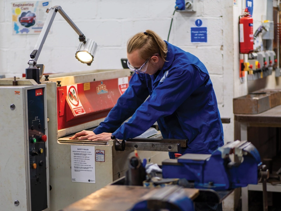 Student working on equipment in engineering workshop