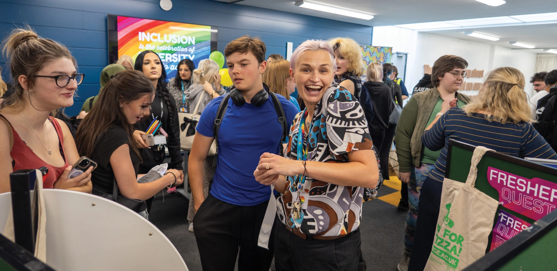Group of people at a fair with one person staring at the camera smiling